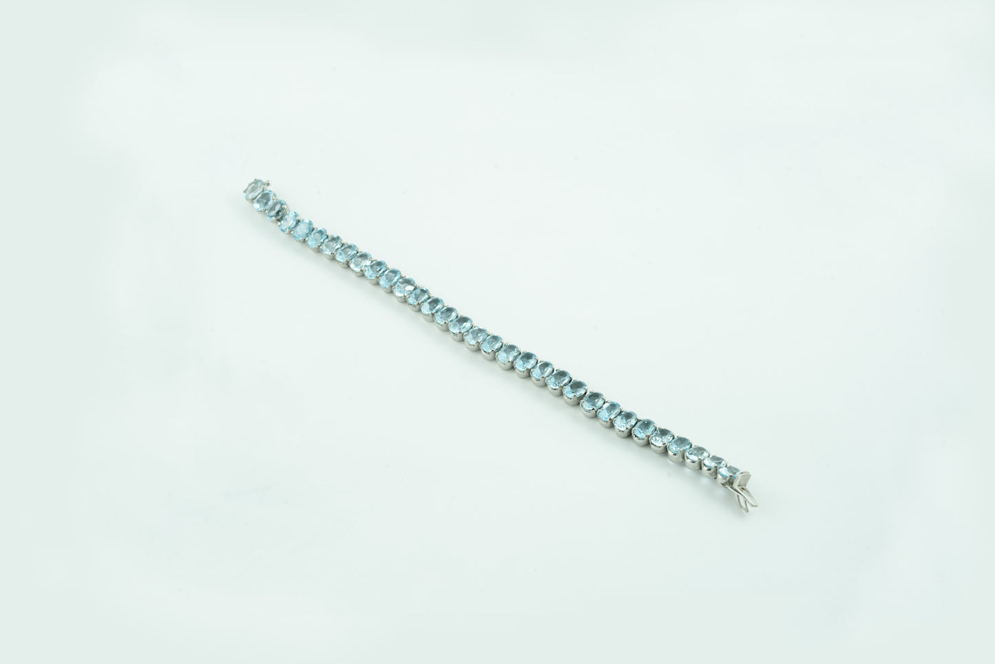 "Woven Drops" Silver Bracelet with Blue Topaz