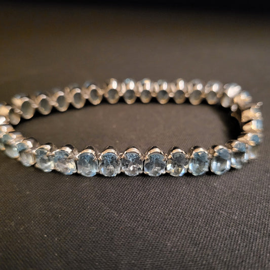 "Woven Drops" Silver Bracelet with Blue Topaz