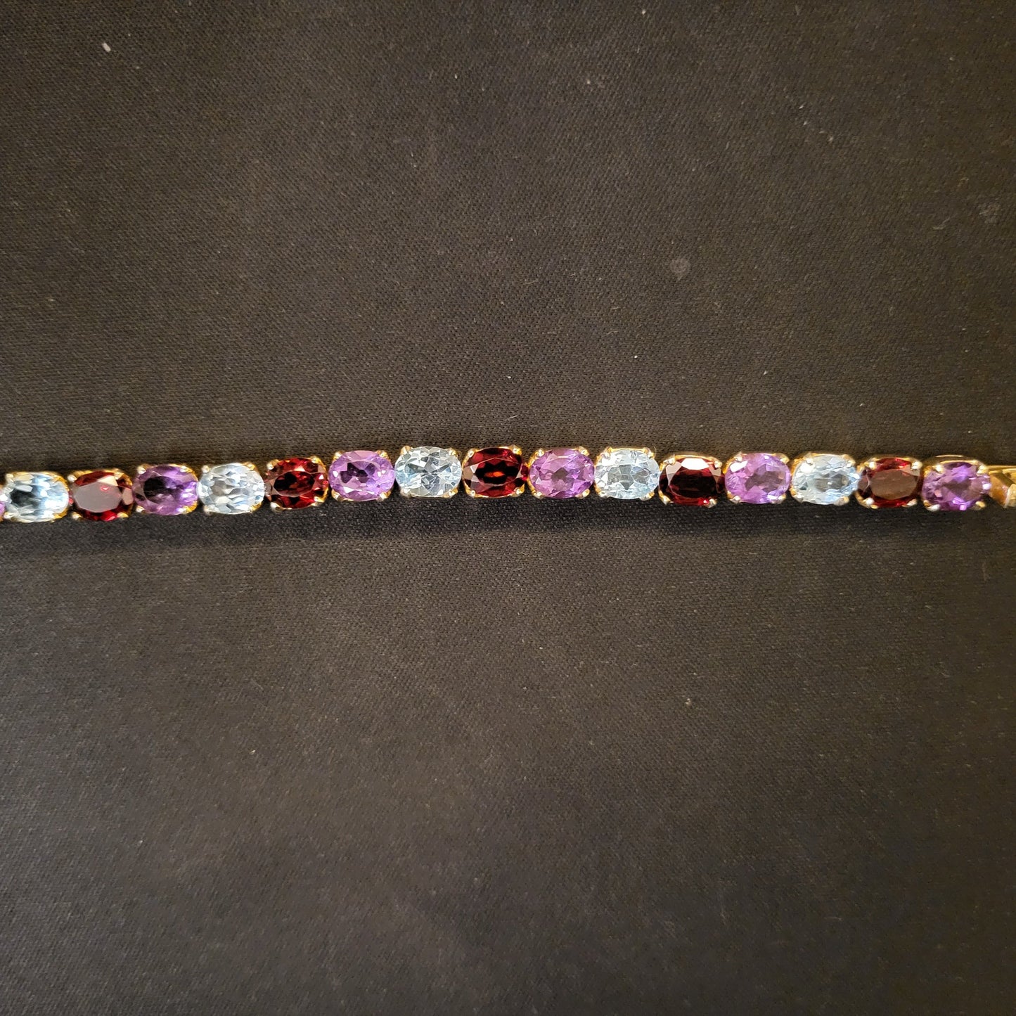 "Precious Symphony" Silver Bracelet with Amethyst, Garnet, and Blue Topaz