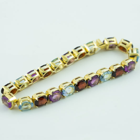 "Precious Symphony" Silver Bracelet with Amethyst, Garnet, and Blue Topaz